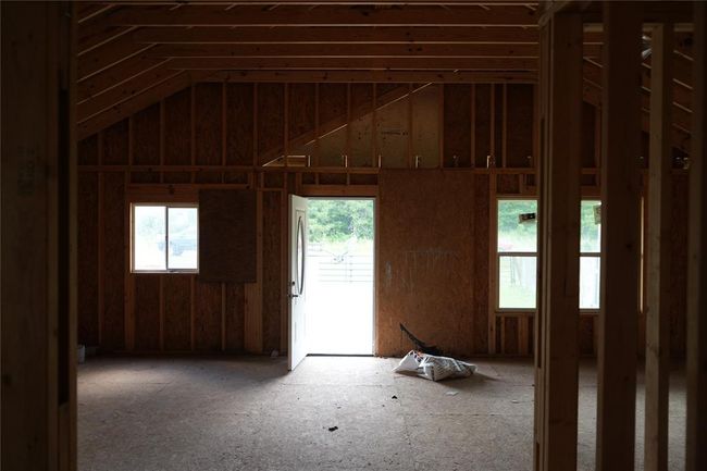 View from Hallway to front door. Kitchen on Right, Living area on Left | Image 16