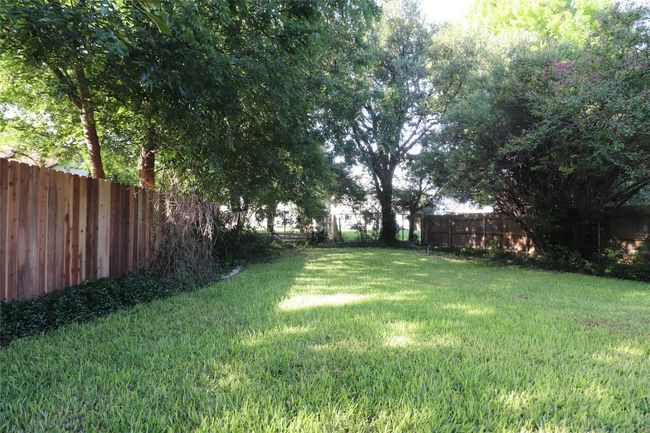 View of fenced backyard | Image 4
