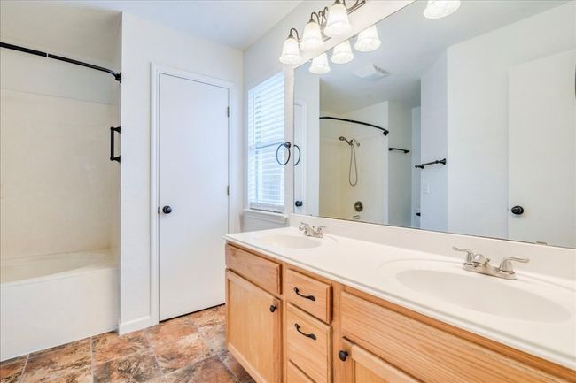 Primary bathroom features garden tub/shower combo and double sinks | Image 22