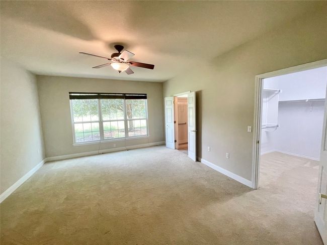 Huge Primary bedroom with gorgeous view of greenbelt. | Image 11