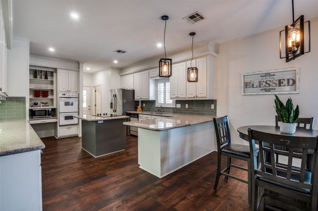 Kitchen with pendant lighting over breakfast bar | Image 14