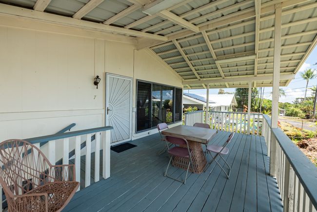 Front Lanai, accessible both from inside your home and two separate access points outside @ 007 Kaapuni Loop in Hilo. | Image 5