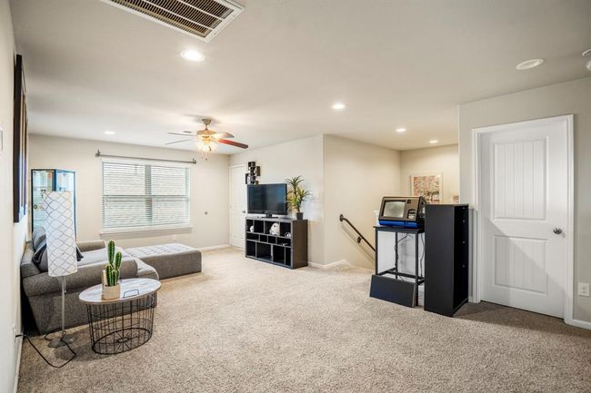 Upstairs you will find a game room and 3 secondary bedrooms, a full bath and an added flex room for extra space. | Image 34