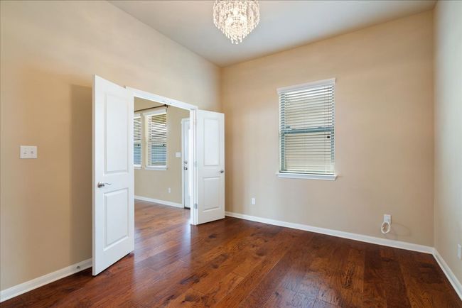Behind the living room is another flex space you could use as a media room, office, guest room, workout space, playroom etc. | Image 26