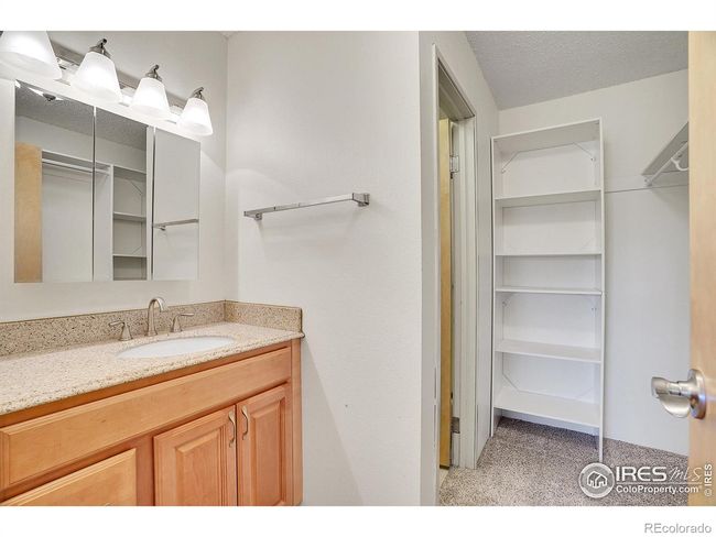 Primary suite bath with updated vanity and sink. | Image 24