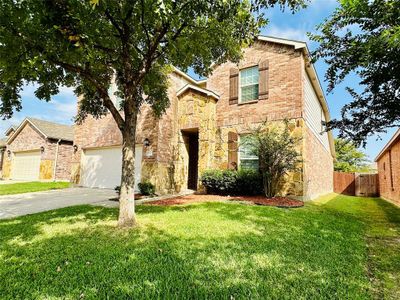 View of front of house featuring a front yard and a garage | Image 3