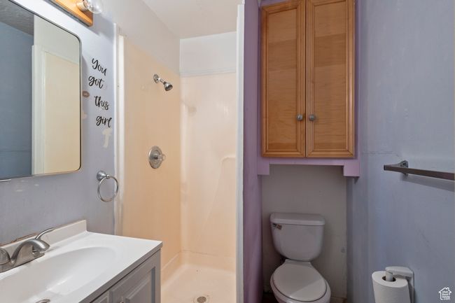 Bathroom with a shower stall and vanity | Image 24