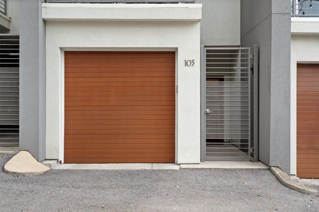 View of garage with personal entry gate for added security | Image 4
