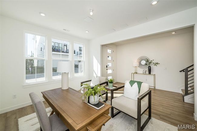 Dining space featuring stairs, wood finished floors, and recessed lighting | Image 34