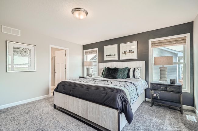 Photo is of the model. Find your retreat in this stunning primary bedroom! | Image 13
