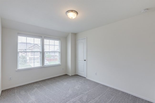 Carpeted empty room with baseboards | Image 18