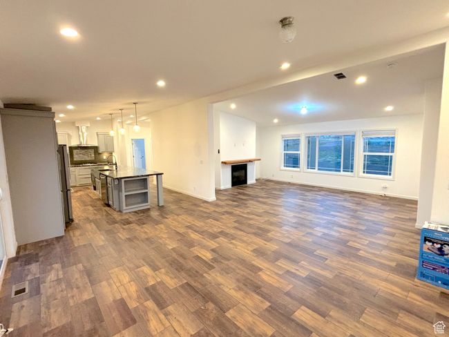 Looking from dining area into kitchen and family room. | Image 4