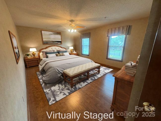 virtually staged large primary bedroom | Image 19