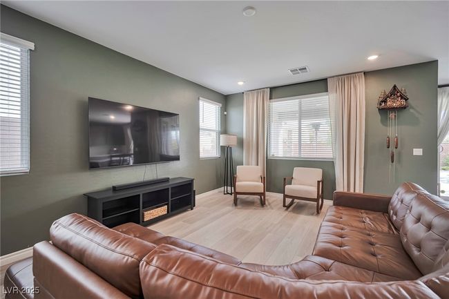 Living room featuring baseboards, visible vents, recessed lighting, and light wood finished floors | Image 4