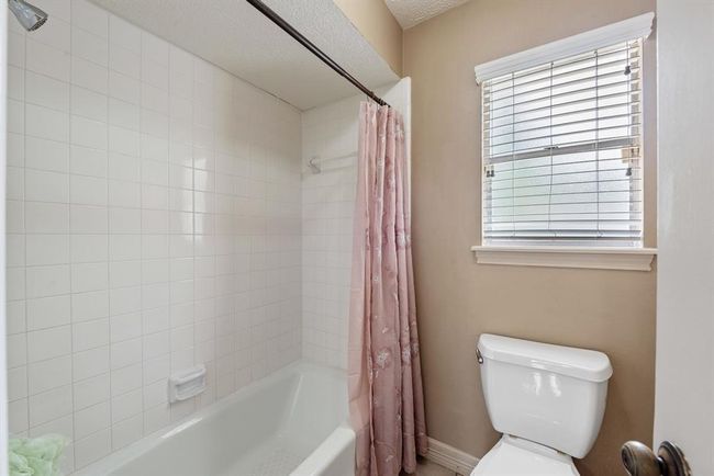 Shower area and water closet are separate from the sink area. | Image 24