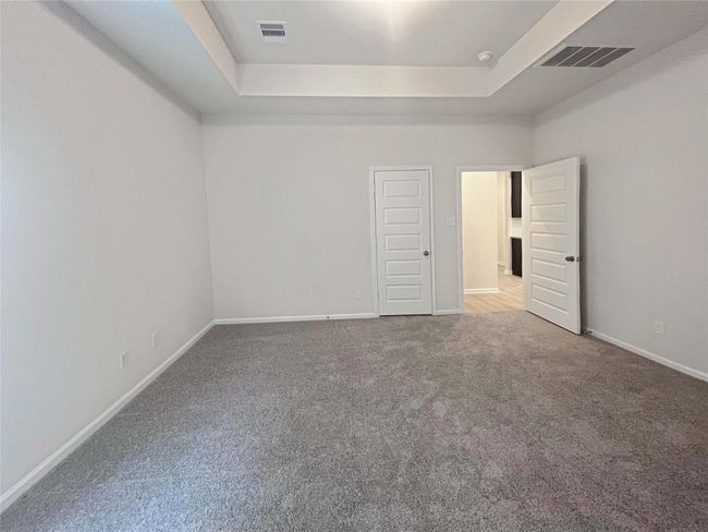 Owner's Suite with Tray Ceiling. Home under construction. Sample floor plan photo used for illustrative purposes only. Upgrades, selections options, windows and colors may vary. | Image 9