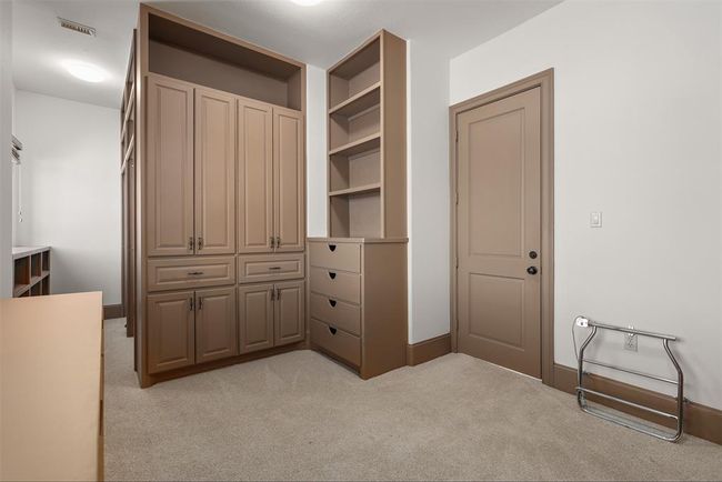 Another view of all the custom cabinets in the fabulous Primary closet. | Image 38