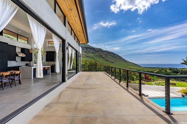 Fleetwood sliding doors pocket together to provide incredible views and access to the expansive wrapping deck. | Image 8