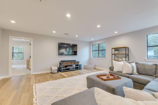 On the second level, there's a spacious family room that could effortlessly be transformed into a game room. | Image 28