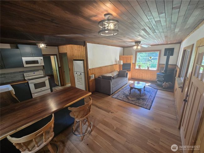 Beautiful hardwood floors and custom woodwork throughout the home. | Image 4