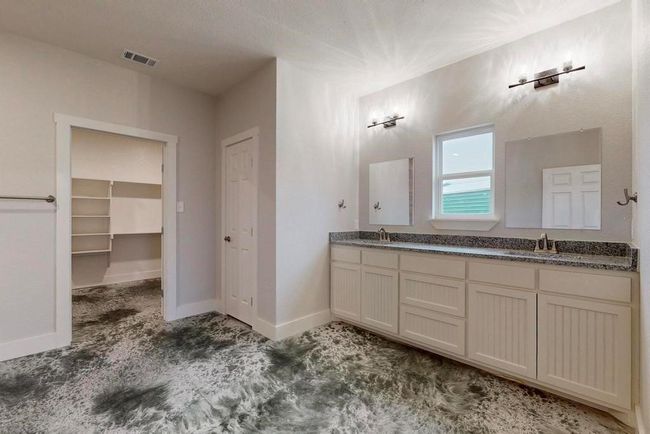 Full bathroom featuring a sink, visible vents, baseboards, and double vanity | Image 17