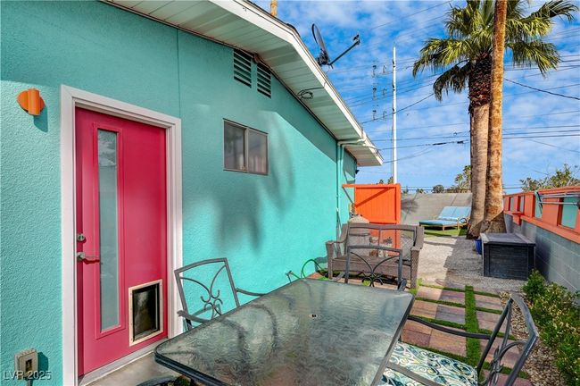 View of patio featuring outdoor dining area and fence | Image 35