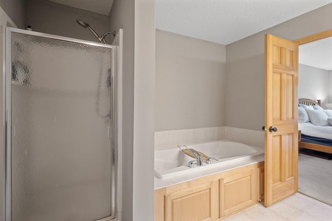 A walk in shower, and large bath. | Image 23