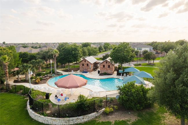 View of pool with a patio area | Image 26