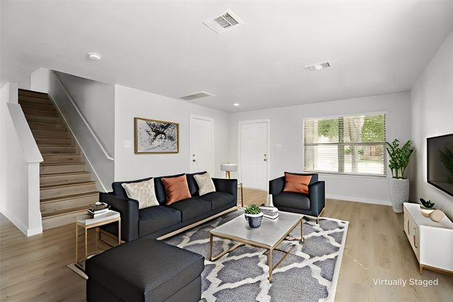 Front living room as you enter the home. Featuring LVP flooring. | Image 8