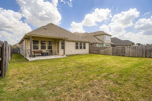 Back of house with a patio area and a fenced backyard | Image 26