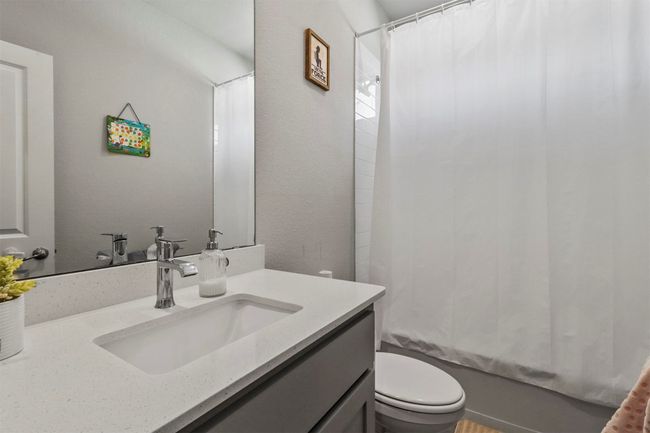 Full bathroom with vanity and shower / bathtub combination with curtain | Image 13