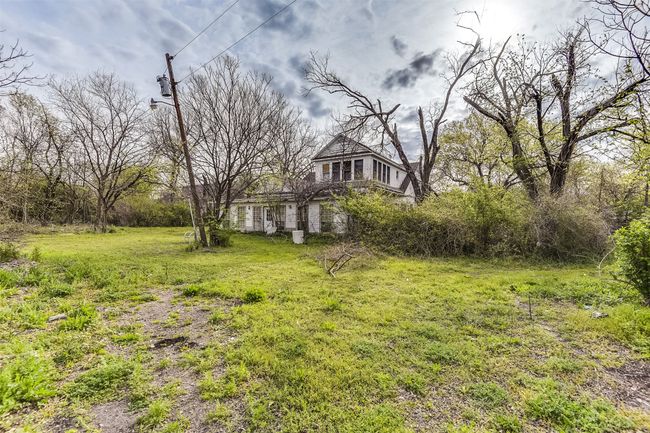 Plenty of yard to do what you want with 1.6+ acres in town! | Image 31