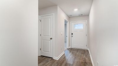 Doorway to outside featuring hardwood / wood-style flooring | Image 2