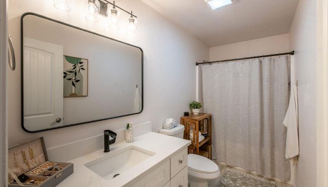 Guest Bathroom with vanity, toilet, and a shower with shower curtain | Image 22