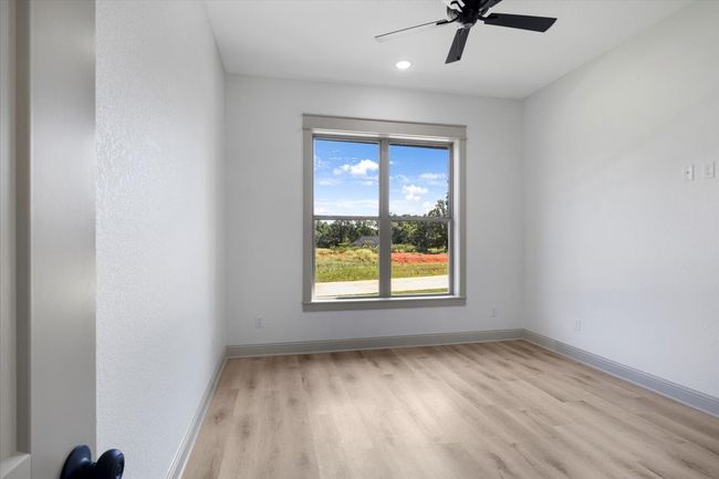 Spare room with light wood-type flooring, a ceiling fan, and recessed lighting | Image 33