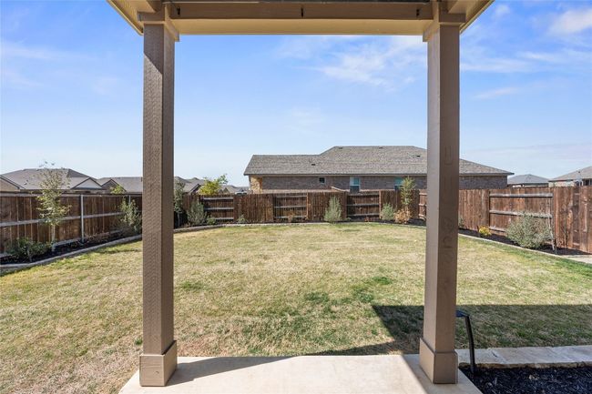 View of yard with a fenced backyard | Image 33