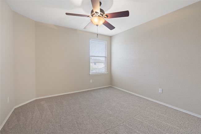Empty room featuring carpet floors and a ceiling fan | Image 33