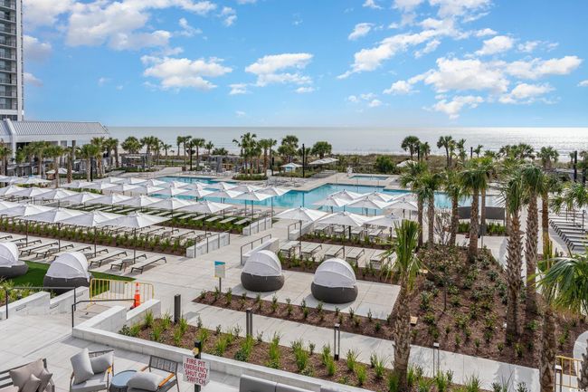 Community pool with a water view | Image 36