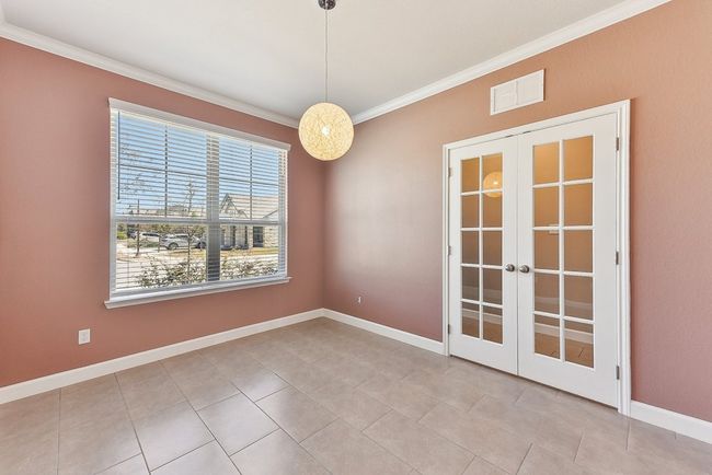 Spare room featuring visible vents, baseboards, ornamental molding, french doors, and tile patterned floors | Image 6