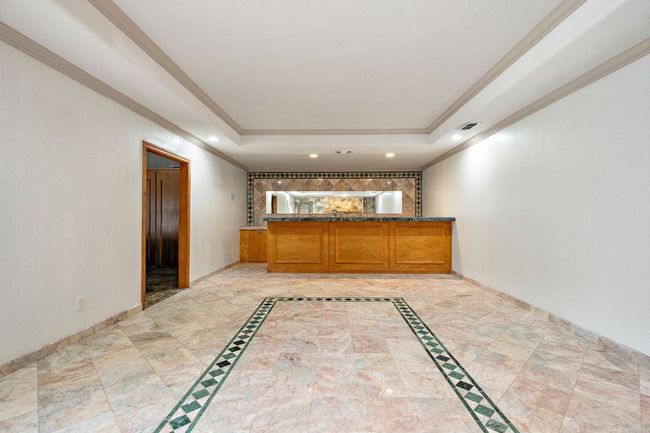Pool house room featuring a bar | Image 32