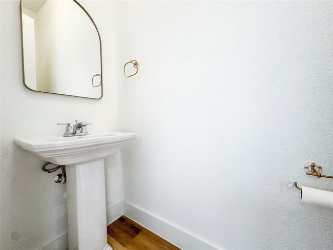 Bathroom with wood finished floors and a sink | Image 17