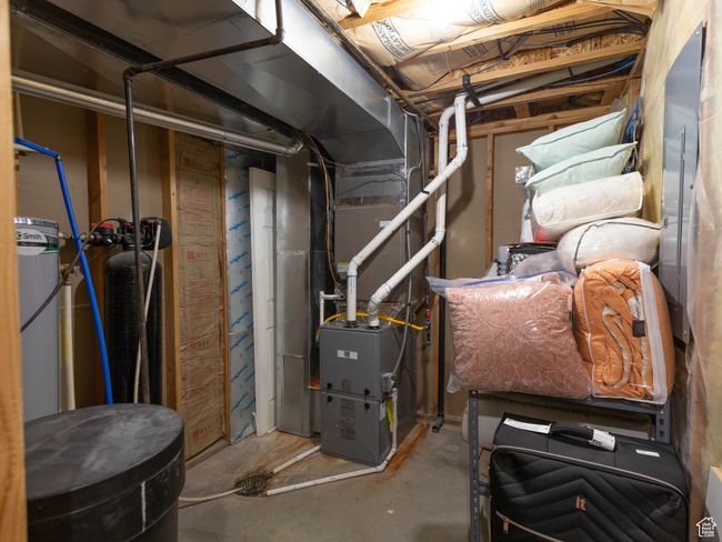 Utility room featuring heating unit | Image 36