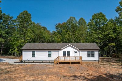 View of front of home featuring a wooden deck | Image 2