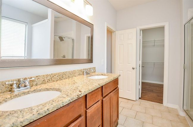 MASTER BATH --GRANITE VANITY TOP WITH DUAL SINKS, NEWLY REPLACED MIRROR, LIGHTING FIXTURE, NEW TOILET AND NEW SHOWER HEAD ) | Image 13