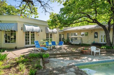 Rear view of house with a patio and french doors | Image 3