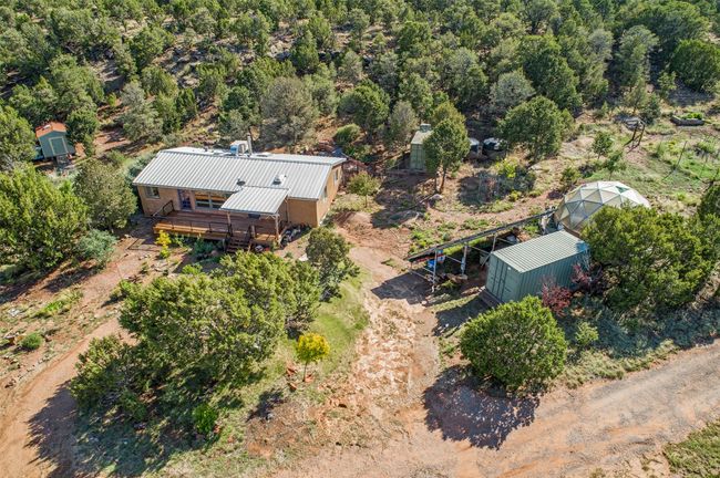 House, driveway and additional parking areas, storage shed, solar array, greenhouse, two storage containers | Image 52