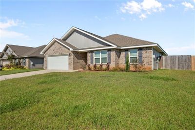 View of front facade featuring a garage and a front lawn | Image 2