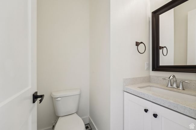 Bathroom with baseboards, toilet, and vanity | Image 21