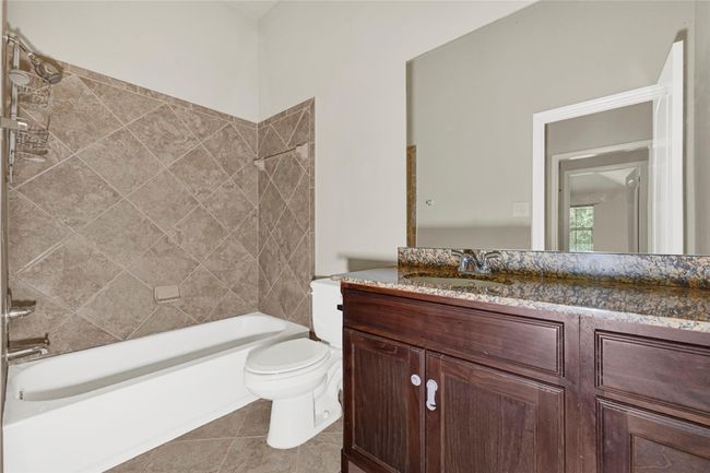 A full bath includes a tub-shower combo and a generously sized vanity—designed for easy morning routines or unwinding after a long day. | Image 34