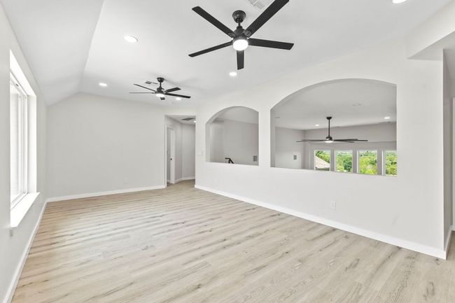 The upstairs gameroom has 2 ceiling fans. | Image 22